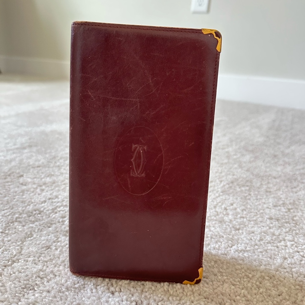 Cartier leather wallet / checkbook holder in Bordeaux burgundy and gold